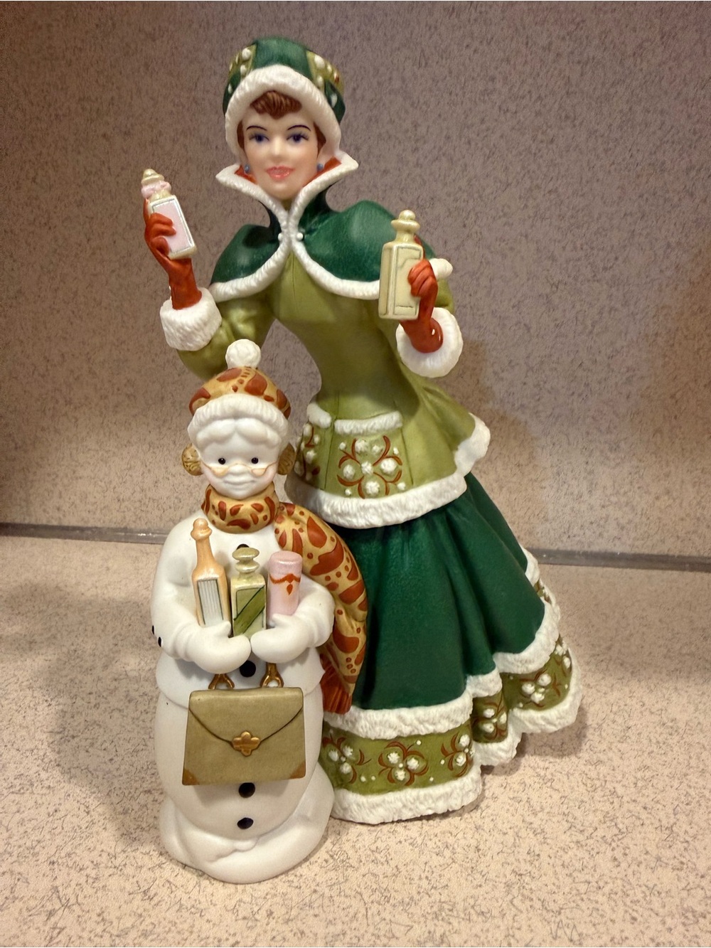 Avon Green & White Victorian Lady with Snowman Holiday Figurine